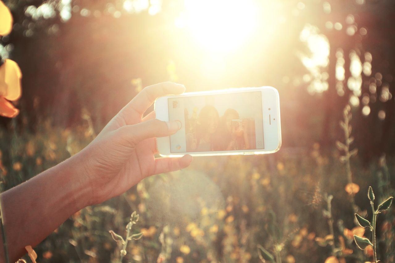 Person on Instagram in field | App Development Surrey