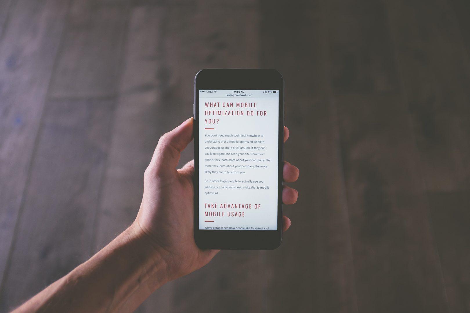A website shown on a phone screen - one of the 2019 trends our web design agency in surrey expect to see next year.