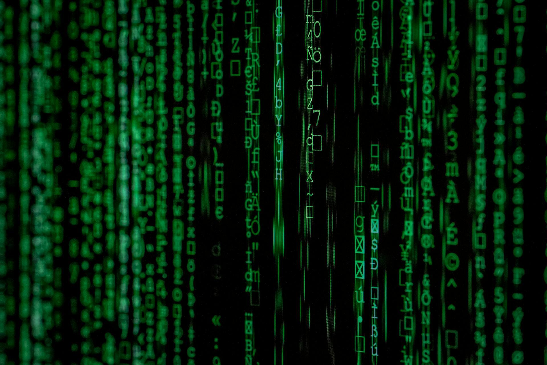 Green strings of text against a black background, representing an algorithm that affects social media marketing