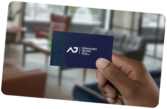 Hand holding an Alexander James business card
