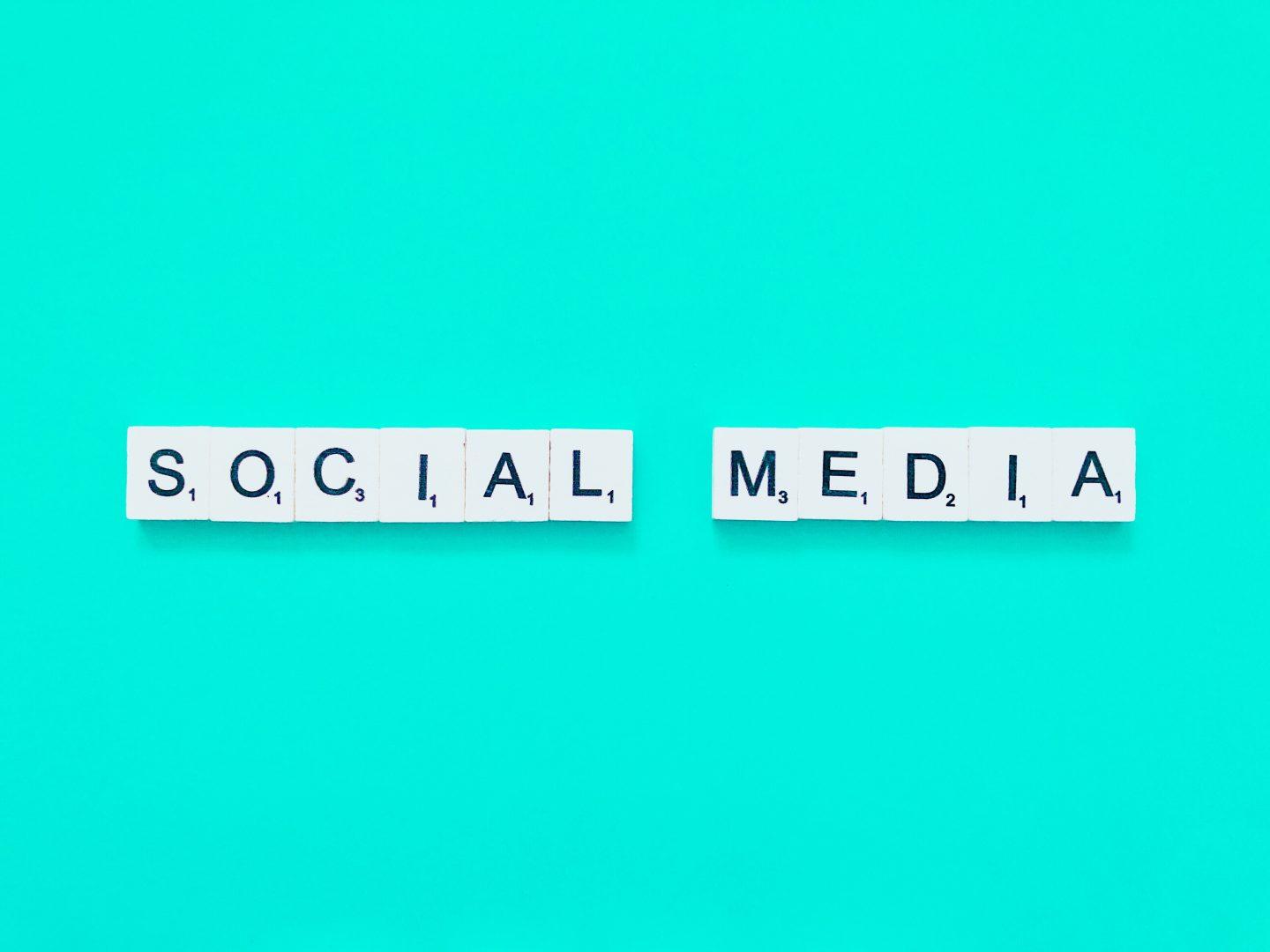Scrabble letters spelling "social media"