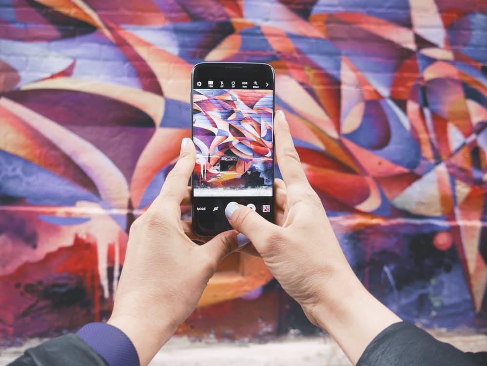 Someone taking a picture on a Samsung | SEO Surrey