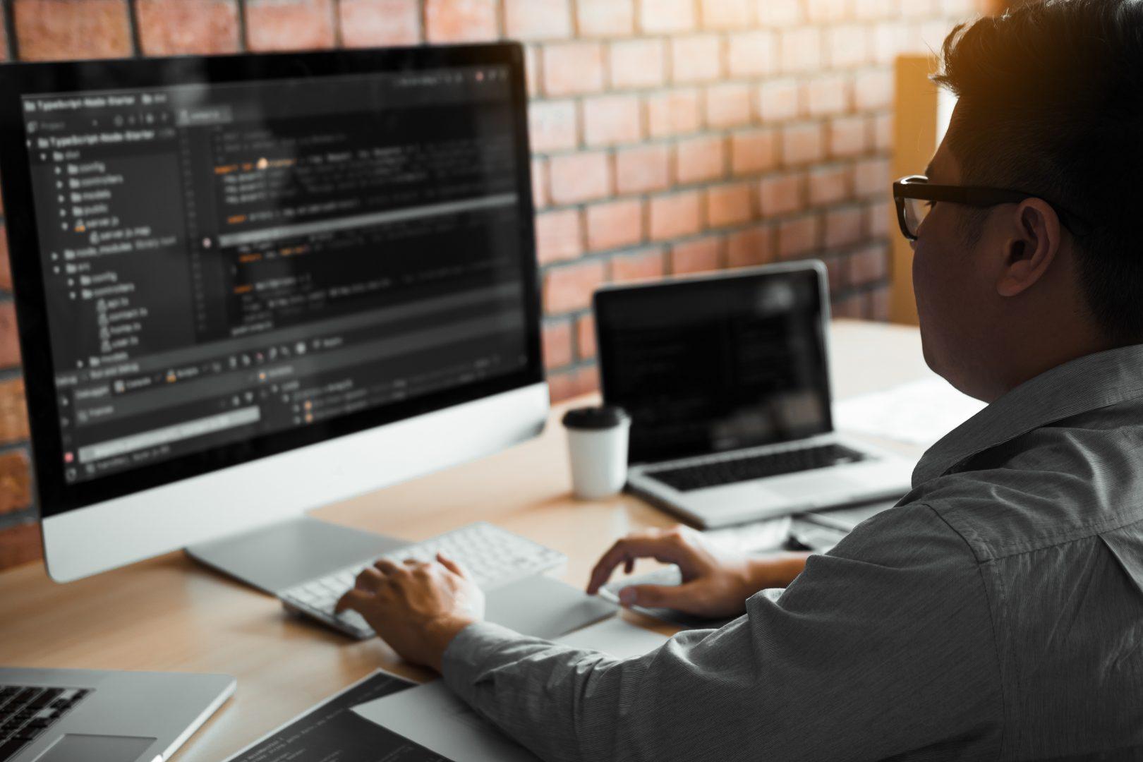 A developer coding at their desk